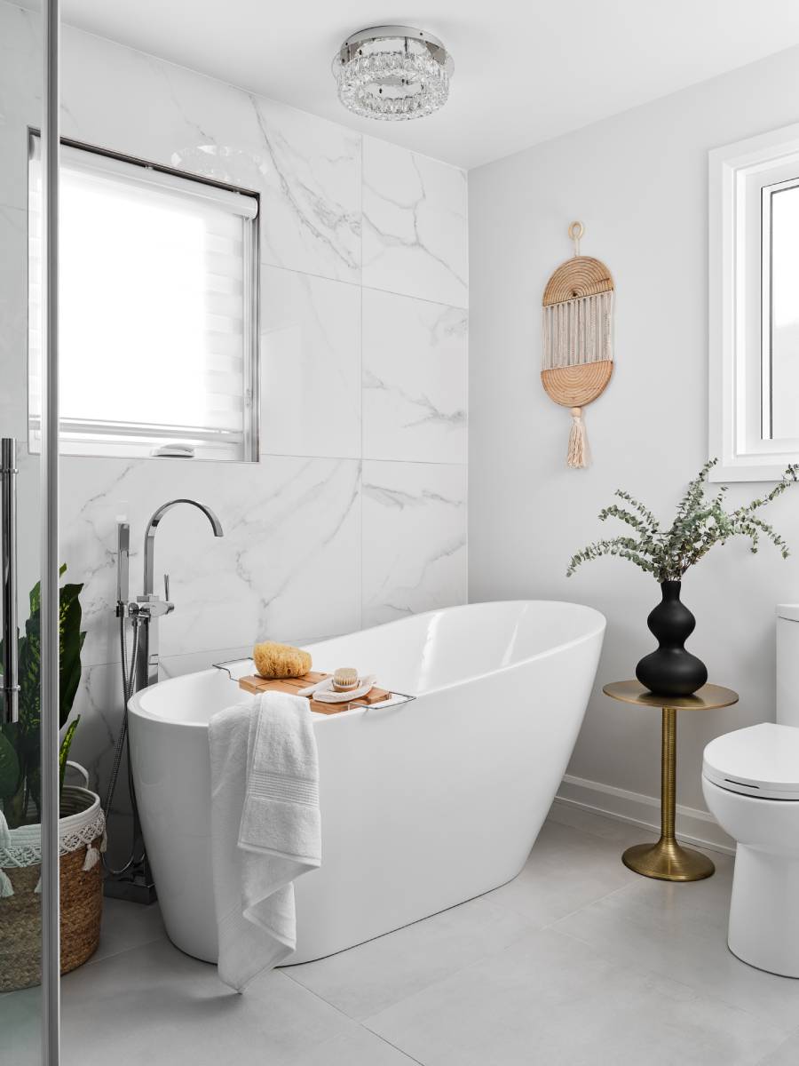 a bathroom with a white tub and a white toilet