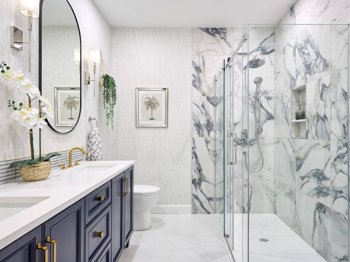 a white and blue bathroom with a large mirror